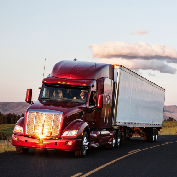 truck-on-a-highway-through-the-grasslands-area-of-2023-11-27-05-14-47-utc